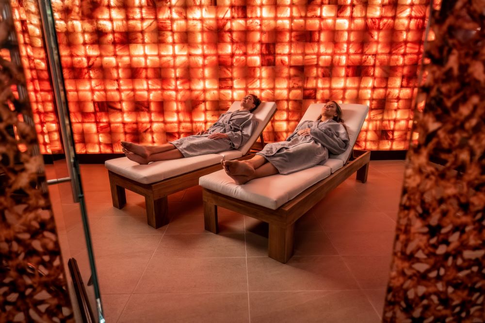 Photo of two women in salt cave treatment room at Spa at Séc-he.