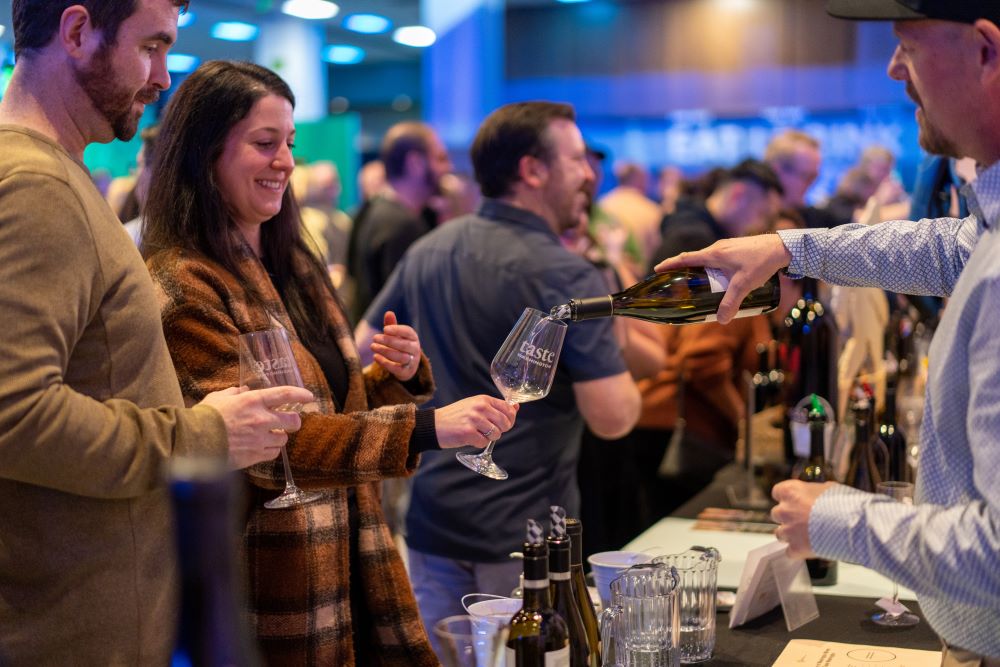 Photo of people at a wine tasting at Taste Washington.