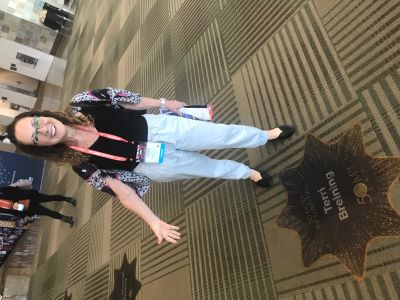 Terri Breining stands next to her star at WEC San Francisco