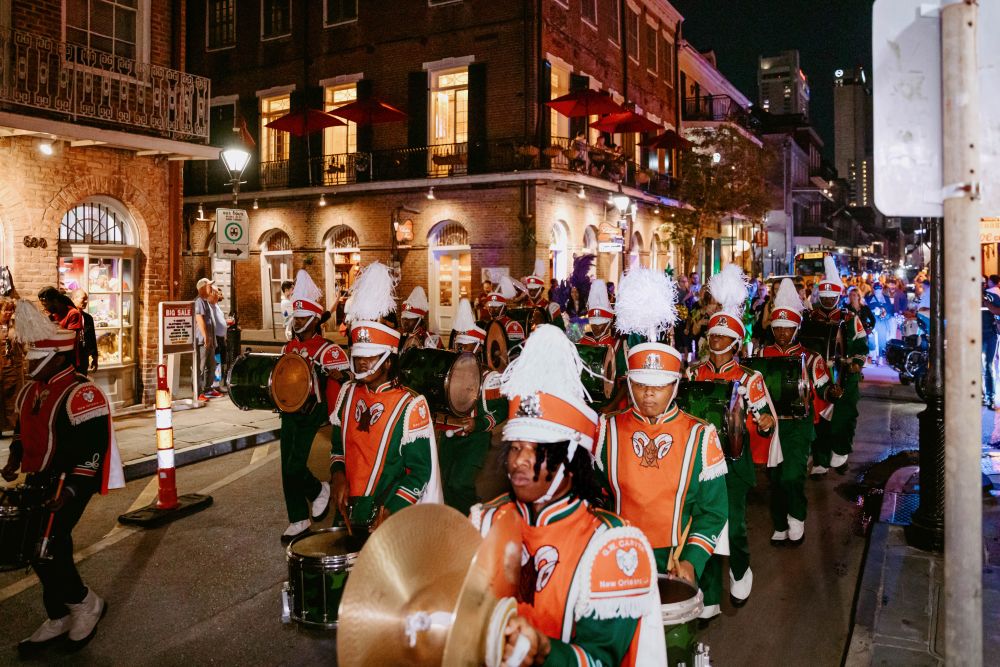 The Carver High School marching band parades down Bourbon Street. 