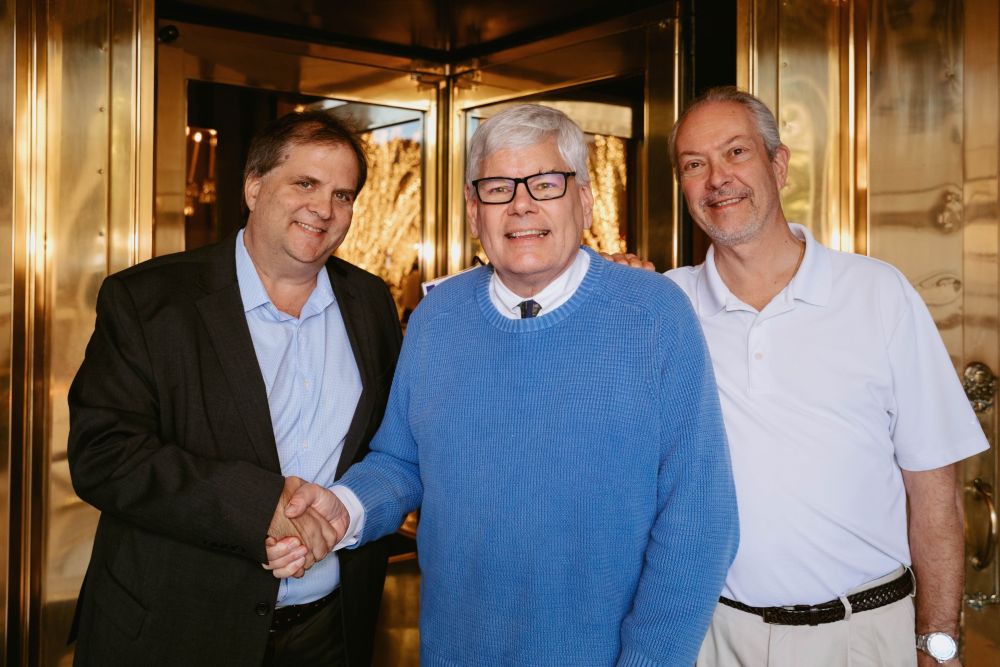 Dean Miller standing with Tyler Davidson and Kirk Lewis of Meetings Today.