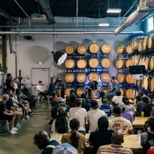 Photo of cask room with a meeting held in it at Urban Roots Events & Catering.