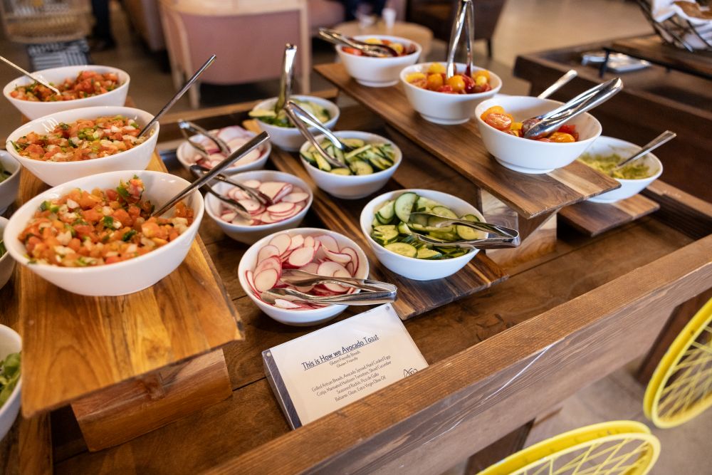 Photo of a table with vegetable side dishes, in a buffet style.