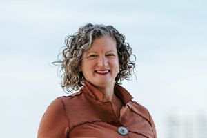 Vic Isley, smiling in a brown shirt.