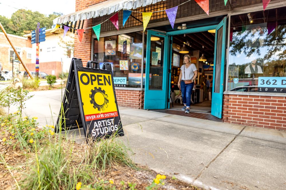 Asheville's River Arts District, with a woman exiting a shop.