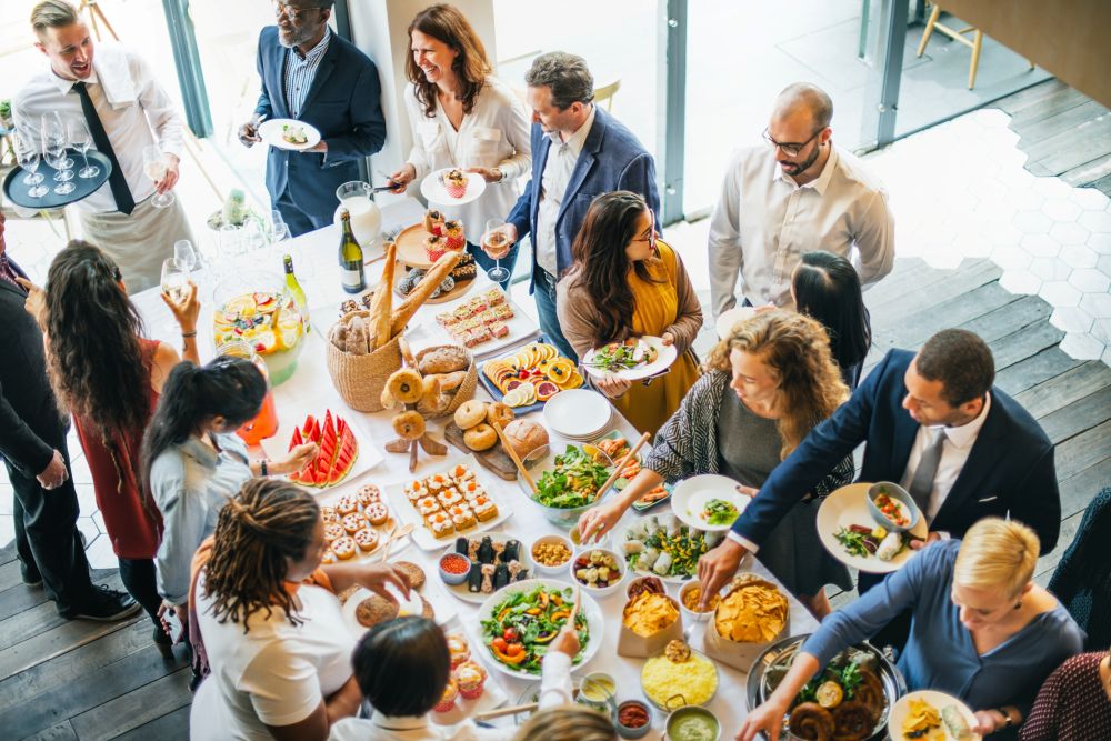 Photo of people eating healthy food at a break table.