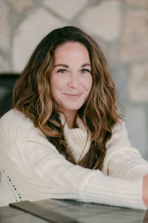 Photo of Ashlee Livingston in a beige sweater.