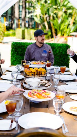 Chef Bernard Foster of Anaheim Convention Center at a dinner table