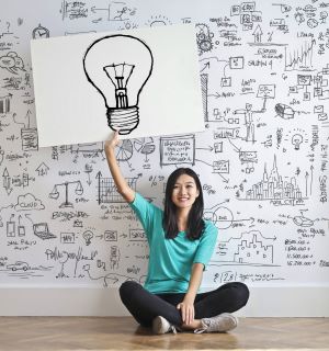 Graphic of woman holding a lightbulb.