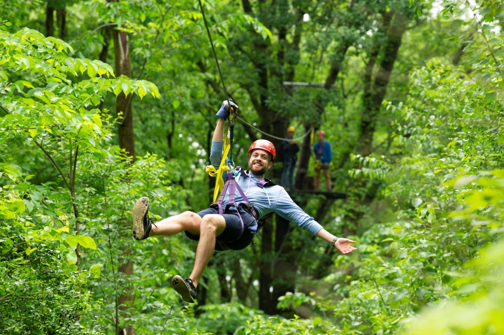 Man on a zipline in Lake Geneva