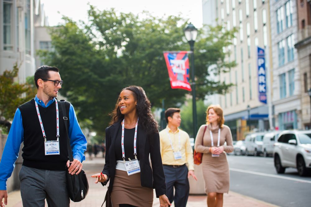 Convention attendees walking down the strees