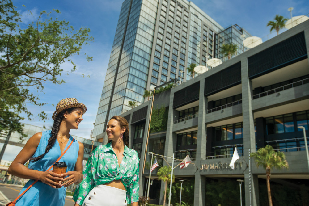 People walking in front of JW Marriott Water Street Tampa Bay