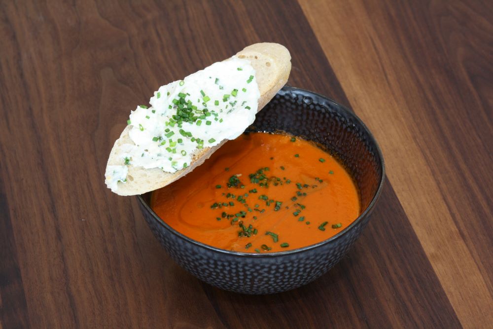 Fresh soup with bread on top