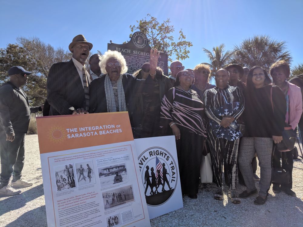 Group standing in front of Newtown Heritage Trail in Sarasota
