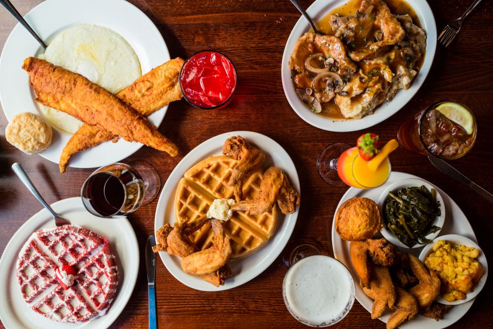 Southern brunch spread with fried chicken and waffles