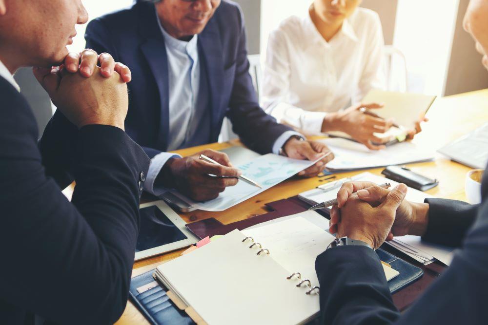 Group in a meeting looking at documents together