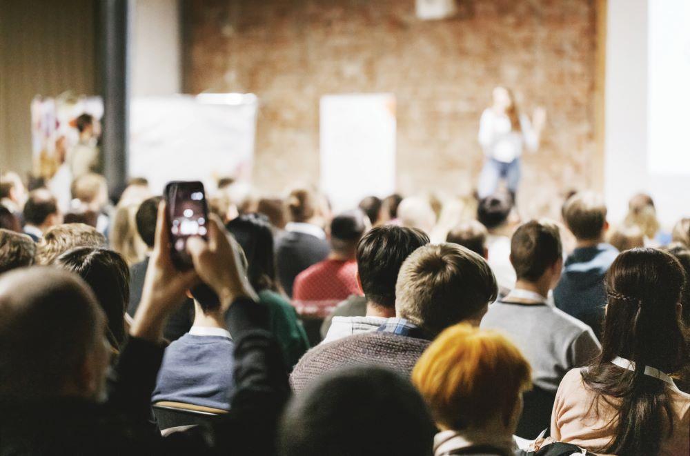 View from the audience of a lecture on stage