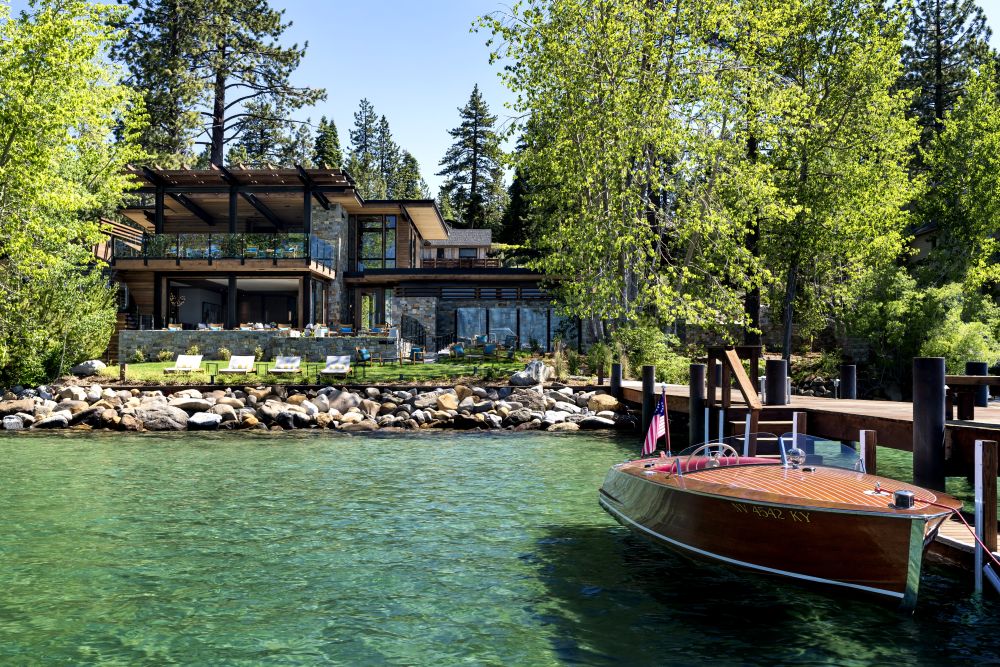 The Ritz-Carlton, Lake Tahoe with a vintage wooden boat at its dock.