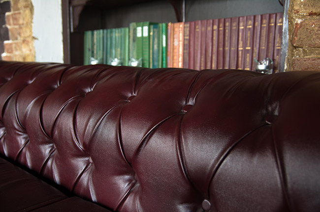 Leather Couch and Bookcase, Fall Design Inspiration, Credit: Shutterstock