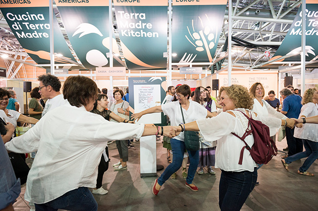 People Holding Hands in Circle at Terra Madre Salone Del Gusto