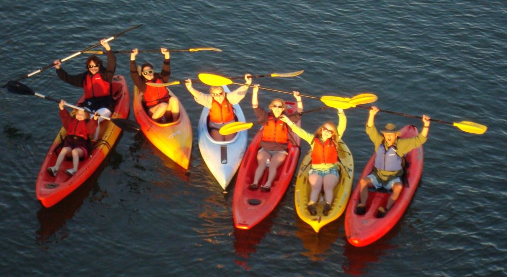 A group of kayakers paddling along the Great Calusa Blueway