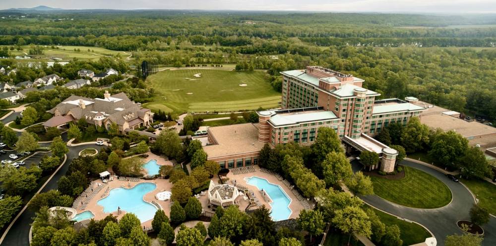 Opened by Benchmark in 1991, the award-winning resort, just 15 minutes from Dulles International Airport, features 296 newly renovated guest rooms and 55,000 square feet of versatile space. Unique offerings include the newly introduced Harmony Model Wellness Program.  Lansdowne aerial CREDIT Matthew Flowers Photography