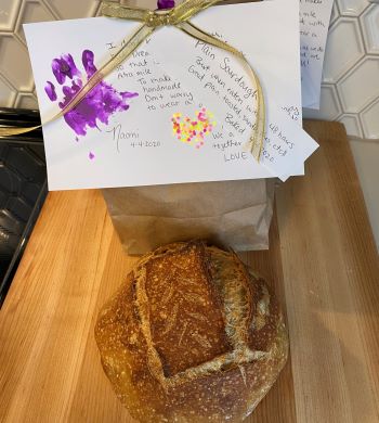 Decorated note and loaf of bread