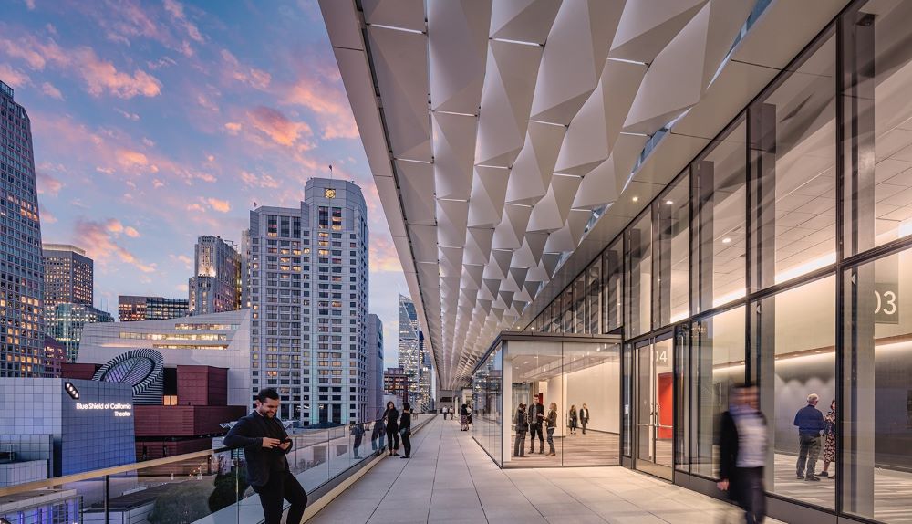 Exterior view of a walkway at the Moscone Center at dusk