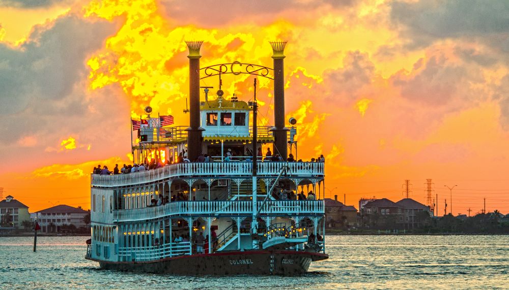 View of Moody Gardens’ Colonel Paddlewheel boat in the sunset