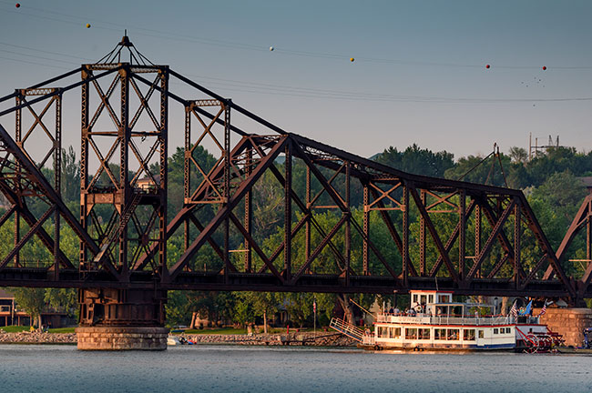 Sunset Paddleboat Going Under Bridge in Pierre, South Dakota