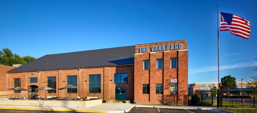 Exterior of the vanguard pub with American Flag flying outside