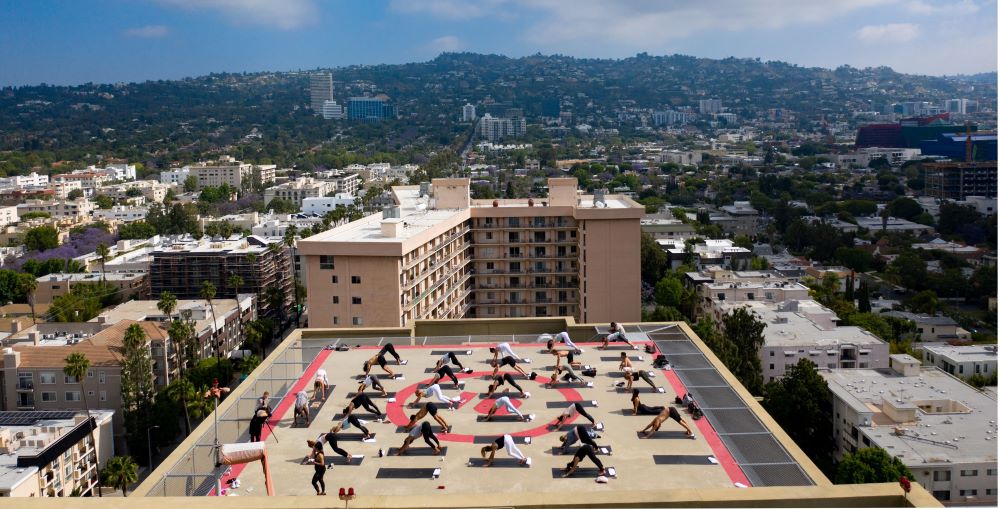 Group doing yoga Class on a helipad