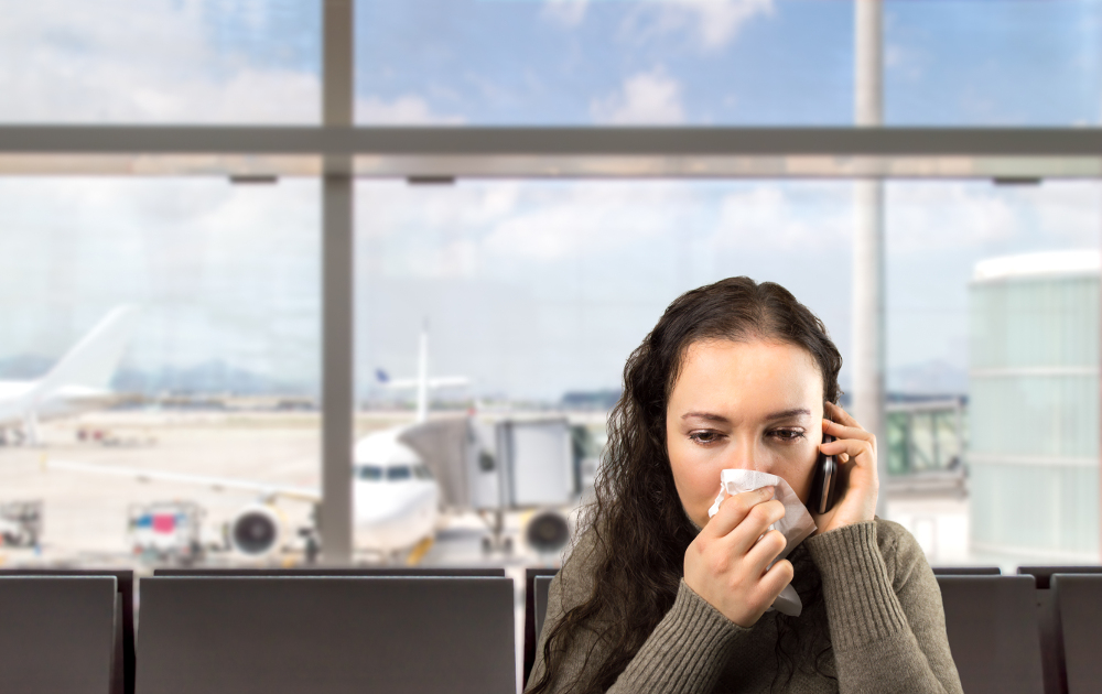 Sick woman calling doctor on the phone.