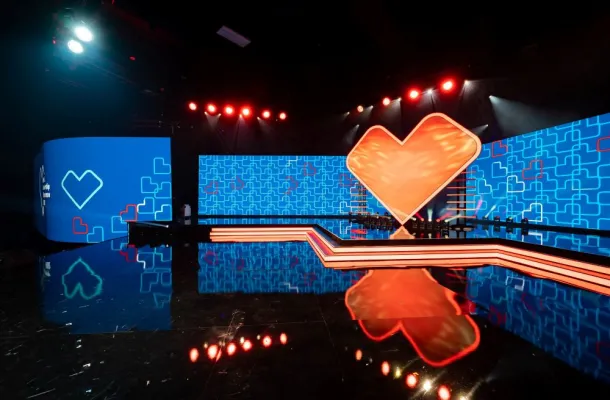 Image of CVS Health's Retail Leadership Experience Event, with a heart on a stage.