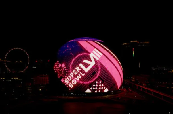 Super Bowl ad on the Sphere exterior in Las Vegas at nighttime