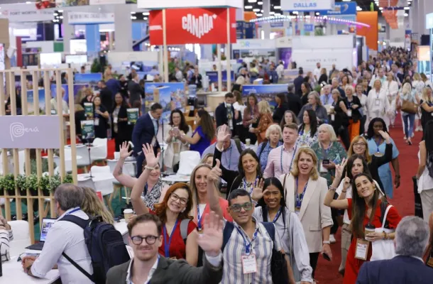 Group of attendees on exhibit floor at IMEX America 2024.