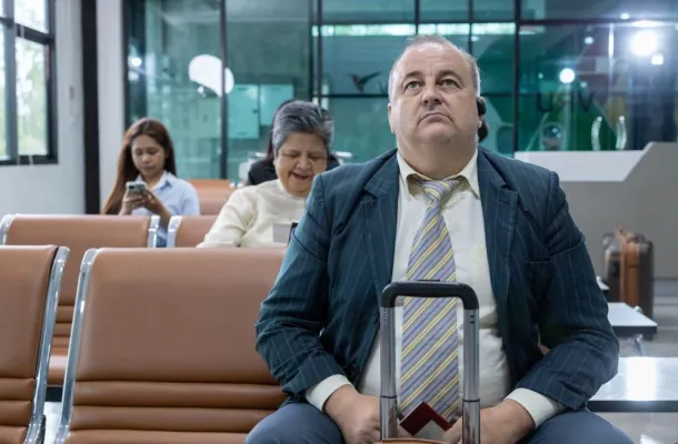 man sitting at airport