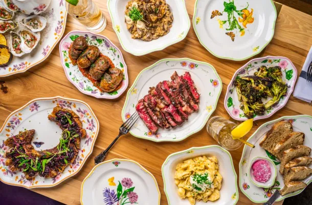 Assorted food dishes laid out on a table next to each other.