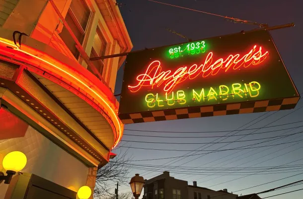  Angeloni's Club Madrid exterior with neon sign.