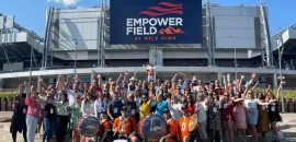 Group shot at Meetings Today LIVE! outside of Empower Field in Denver
