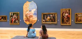 Two people observing art at RISD Museum in Providence, Rhode Island