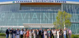 Photo of Savannah convention center and DMO community gathered in front of the expanded Savannah Convention Center.