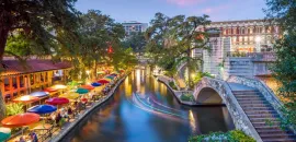 Photo of the San Antonio River Walk at dusk.