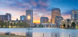 Skyline of Irving, Texas, with Lake Carolyn in foreground.