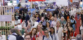 Group of attendees on exhibit floor at IMEX America 2024.