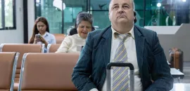 man sitting at airport