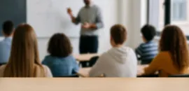 Students and teacher in a classroom. 