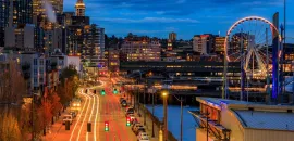 Image of the Seattle waterfront at night.