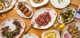 Assorted food dishes laid out on a table next to each other.