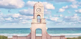 Worth Avenue Clock Tower, with the ocean in the background.